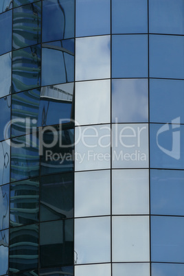 Reflection in windows of modern office building