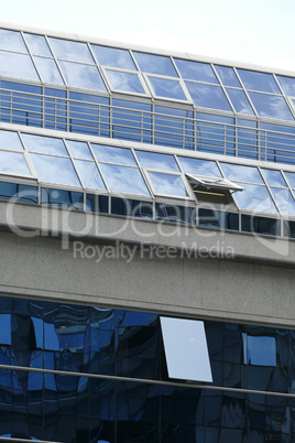 Reflection in windows of modern office building