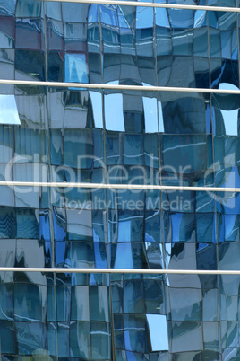 Reflection in windows of modern office building