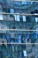 Reflection in windows of modern office building