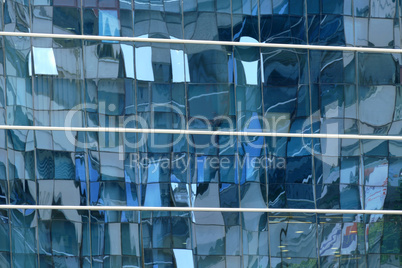 Reflection in windows of modern office building