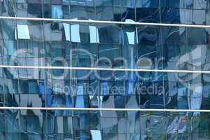 Reflection in windows of modern office building