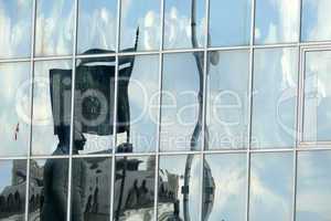 Reflection in windows of modern office building