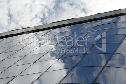 Reflection in windows of modern office building