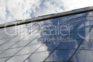 Reflection in windows of modern office building