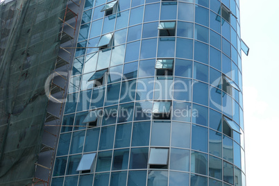 Reflection in windows of modern office building