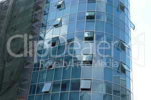 Reflection in windows of modern office building