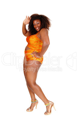 African woman in bikini waiving hand.