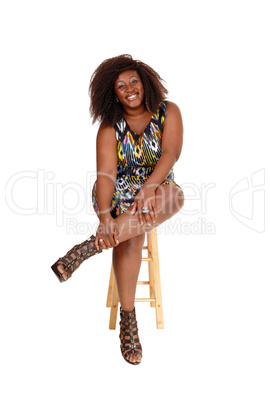 Pretty African woman sitting.