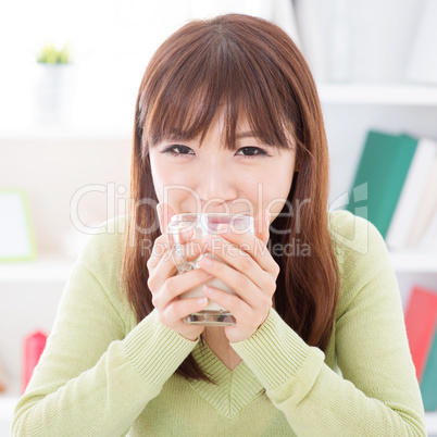 Asian female drinking soymilk