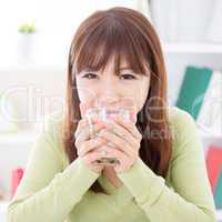 Asian female drinking soymilk