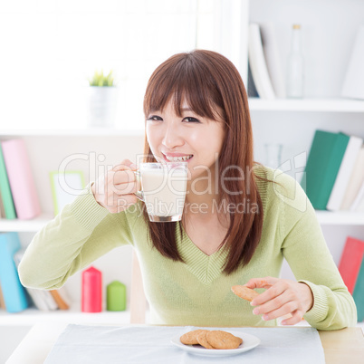 Asian female drinking milk