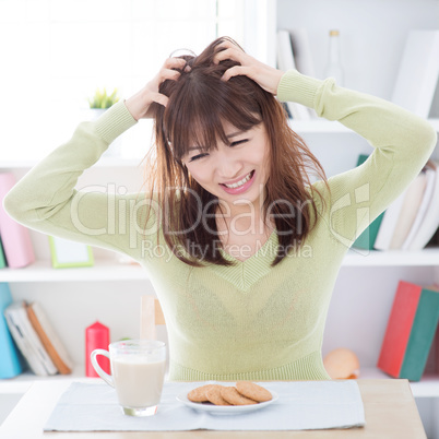 Asian girl feeling bored with her breakfast