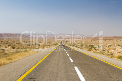 Beautiful road in the desert .