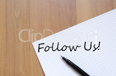 Follow us concept Notepad