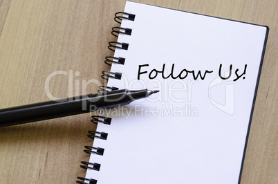 Follow us concept Notepad