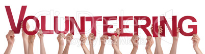 Hands Holding Red Straight Word Volunteering