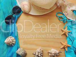 Summer sea composition on wooden background.
