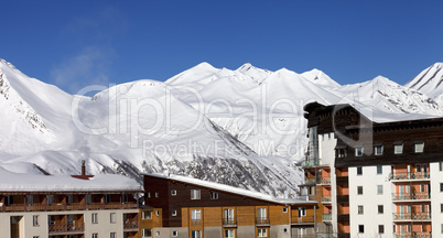 Snowy hotels in winter mountains at nice day