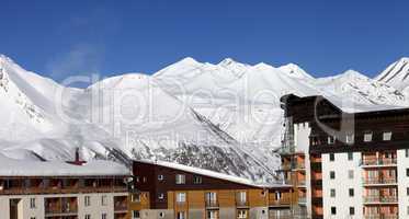 Snowy hotels in winter mountains at nice day