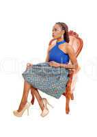 Gorgeous African woman in armchair.