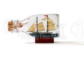 Two-masted ship in a bottle isolated on white background