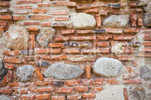 Rustic old wall background made of bricks and stones