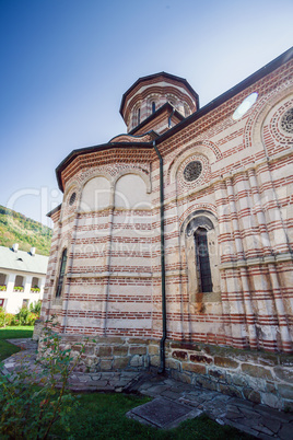 Cozia monastery church with visiting tourists