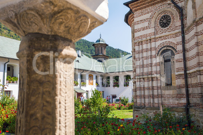 Cozia monastery church with visiting tourists