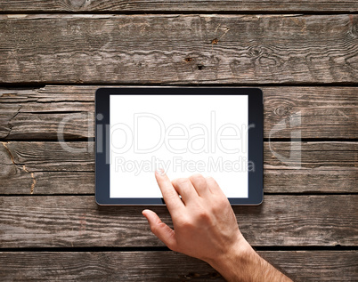 Man is going to touch screen of digital tablet