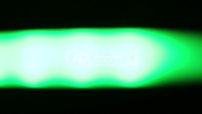 Horizontally moving green LED light at night