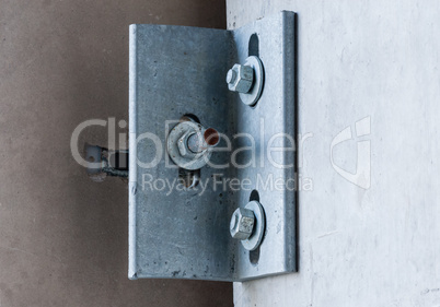 Metal corner bracket on concrete wall