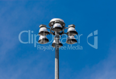 Top of flood lights pointing down on sky
