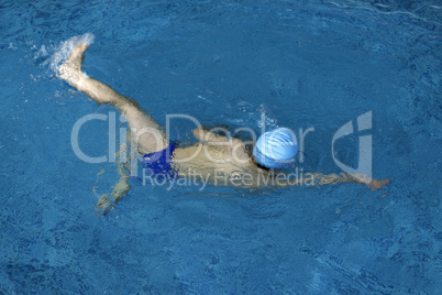 Child swimmer in swimming pool