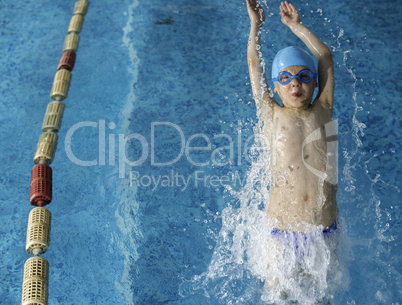 Child swimmer in swimming pool