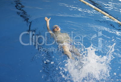 Child swimmer in swimming pool