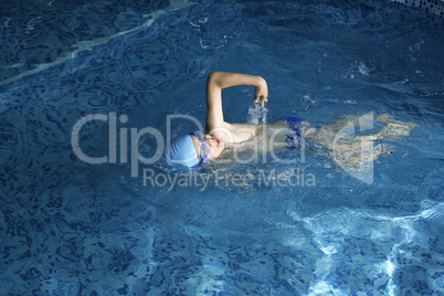 Child swimmer in swimming pool