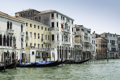 Ancient buildings and boats in the channel in Venice