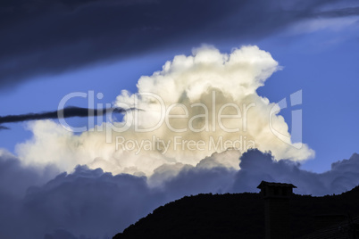 Dramatic clouds and deep blue sky