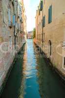 Ancient buildings in the channel in Venice.