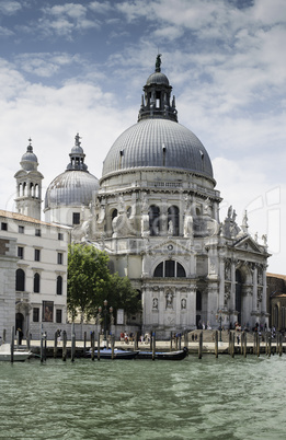 Ancient buildings and boats in the channel in Venice