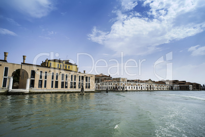 Ancient buildings in Venice. Boats moored in the channel