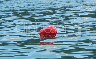 Red buoys on the sea water.