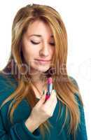 Beautiful woman holding lipstick