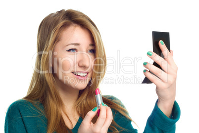 Closeup portrait of beautiful young woman with lipstick and mirror