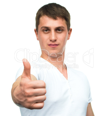 Young man shows thumb up gesture