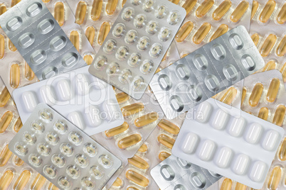 Hintergrund aus vielen Tabletten und Gel Kapseln im Blister