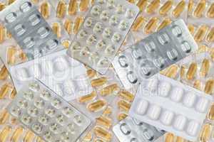 Hintergrund aus vielen Tabletten und Gel Kapseln im Blister