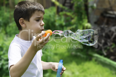 Child makes bubbles