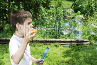 Child makes bubbles